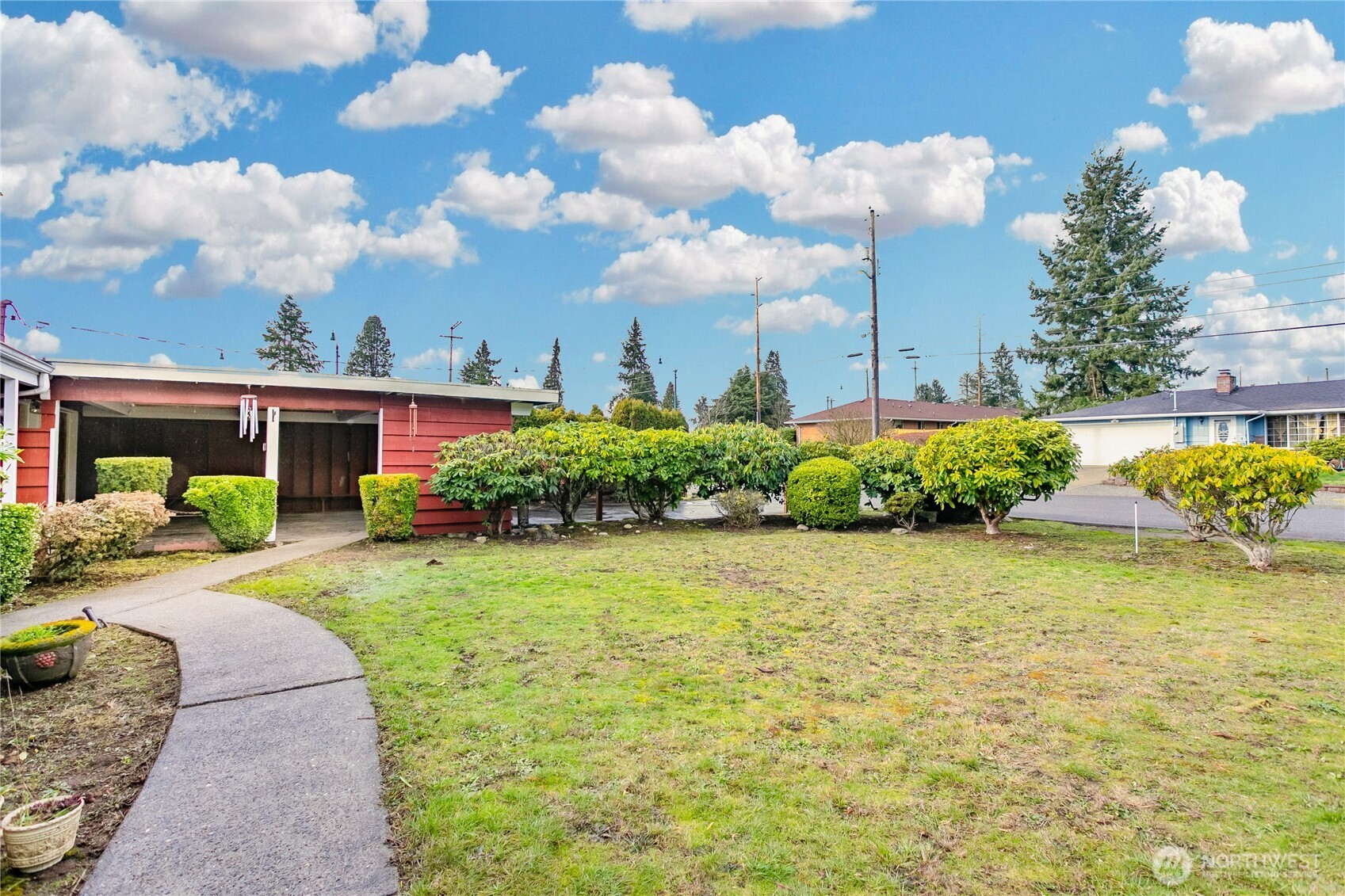 7416 25th Street West Tacoma, WA 98466 - Photo 3 of 39 a front view of a house with garden