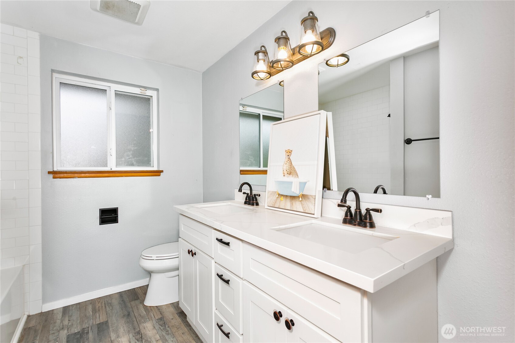 7416 25th Street West Tacoma, WA 98466 - Photo 31 of 39 a bathroom with a sink and a mirror
