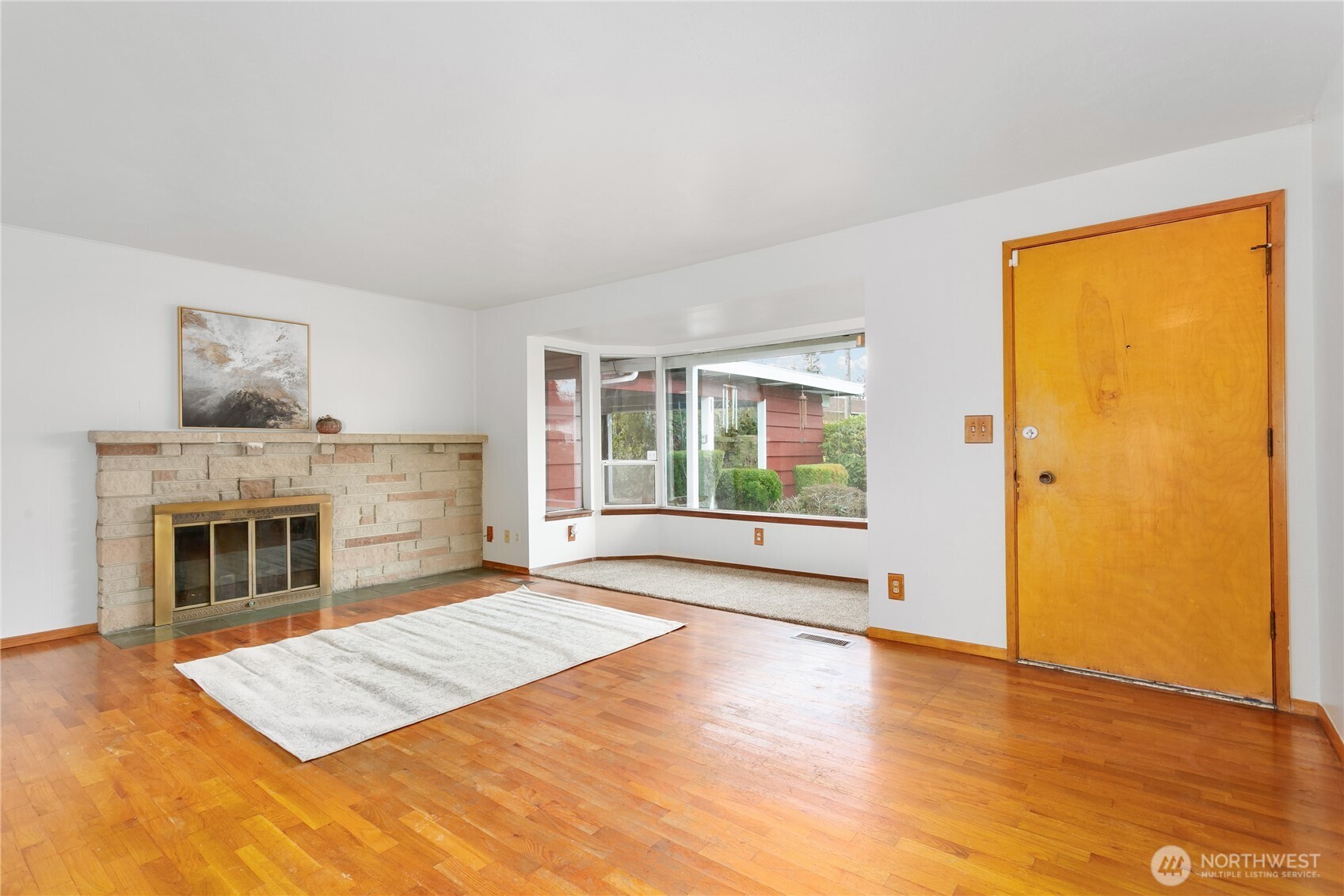 7416 25th Street West Tacoma, WA 98466 - Photo 6 of 39 a view of livingroom with furniture window and wooden floor