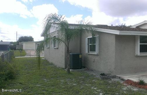 2042 Nottingham Road Melbourne, FL 32935 - Photo 14 of 16 Side Yard