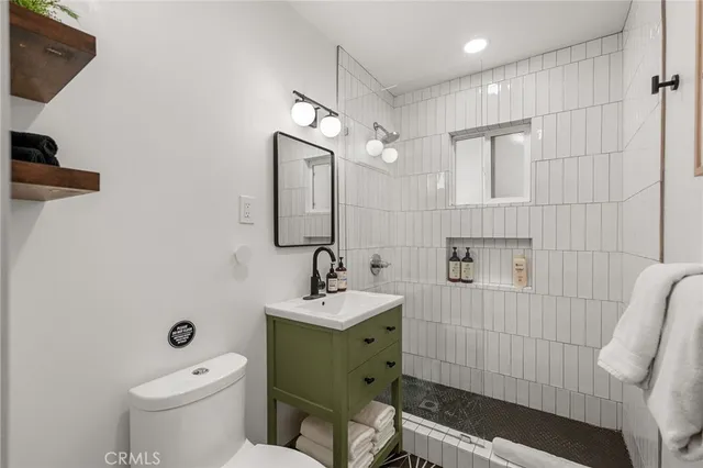 a bedroom with a bed and a chair