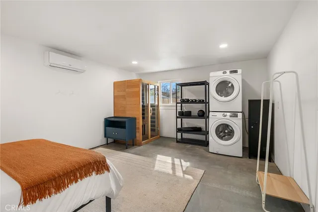 a bedroom with a bed and a night stand