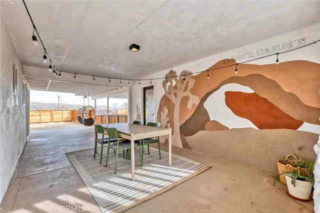 a view of a livingroom with furniture and front door