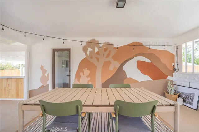 a view of a chairs and table in the patio