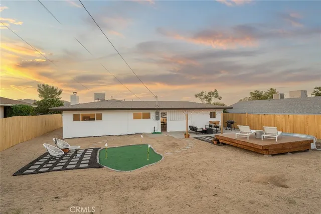 a view of a livingroom with furniture and a rug