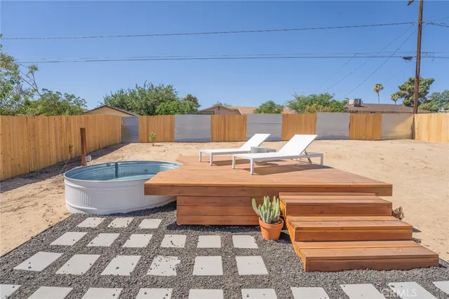 a table and chairs sitting in front of a house