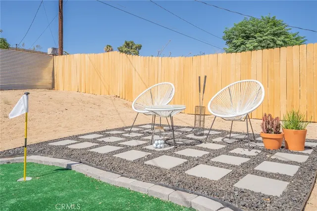a outdoor space with patio the couches and dining table with potted plants