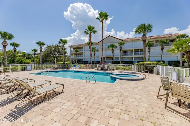 a view of a lake with boats next to a road