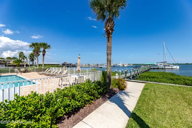 a view of a lake with boats and trees