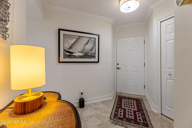 a bedroom with furniture and a flat screen tv