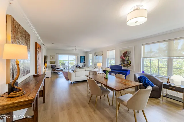 a spacious bathroom with a double vanity sink mirror and bathtub