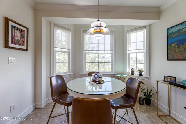 a bedroom with a bed and a chair