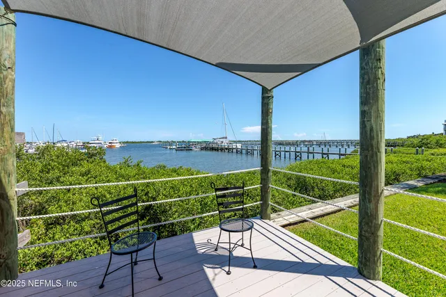 a view of a swimming pool and lounge chair