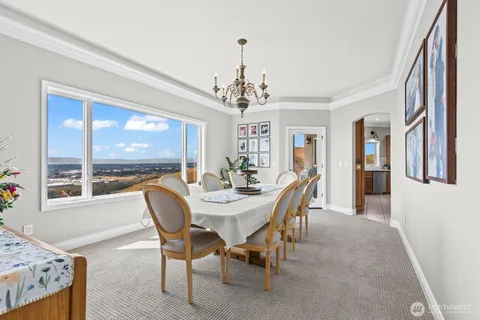a view of chairs and table in the balcony