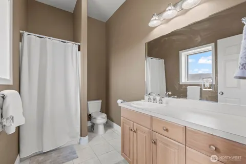 a kitchen with a sink appliances and cabinets