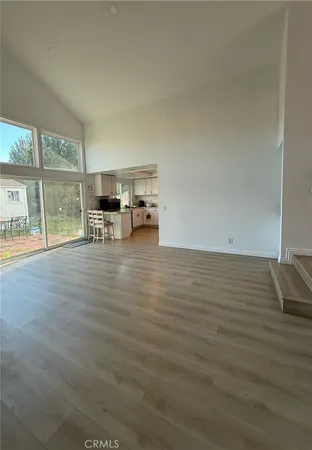 a view of an empty room and a window