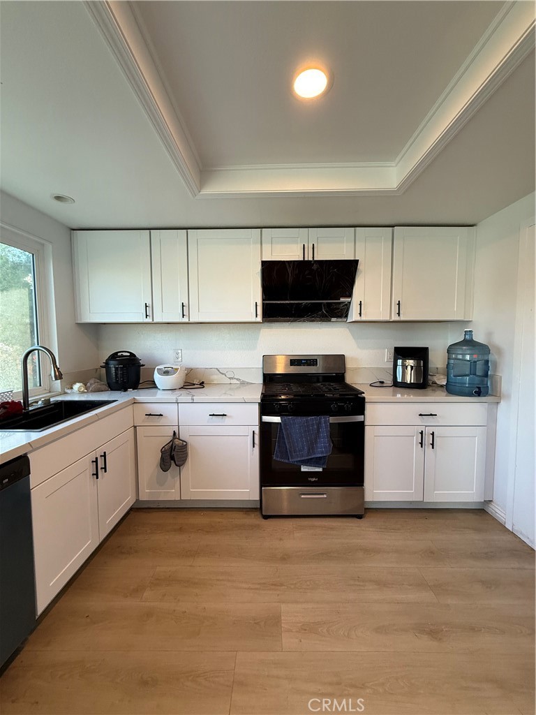 18104 Rio Seco Drive Rowland Heights, CA 91748 - Photo 16 of 31 a kitchen with sink a microwave and cabinets
