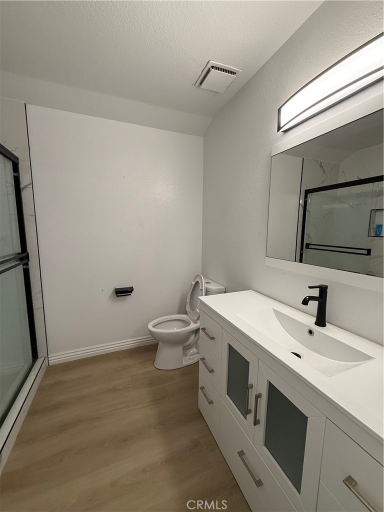 18104 Rio Seco Drive Rowland Heights, CA 91748 - Photo 17 of 31 a bathroom with a sink mirror vanity and toilet