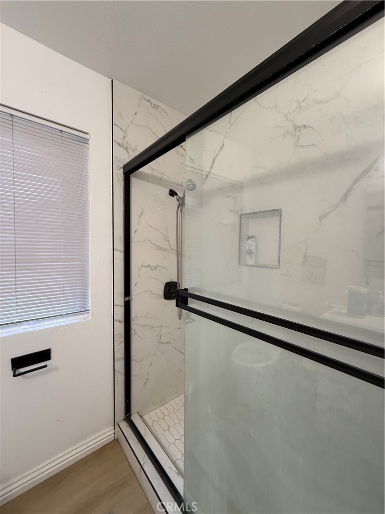 18104 Rio Seco Drive Rowland Heights, CA 91748 - Photo 18 of 31 a bathroom with a glass shower door