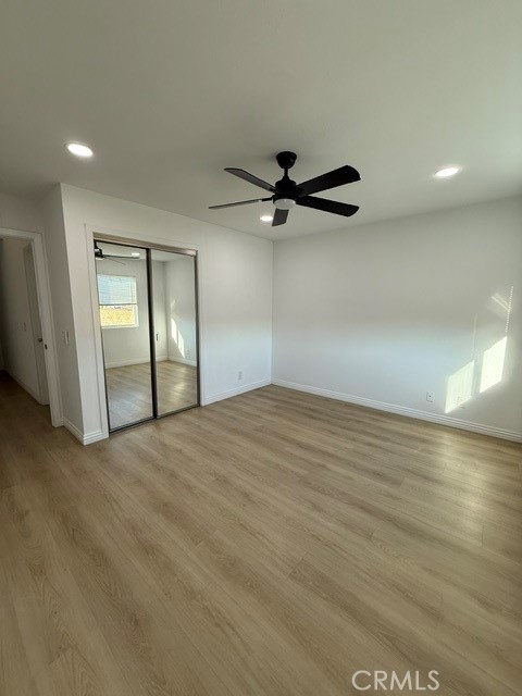 18104 Rio Seco Drive Rowland Heights, CA 91748 - Photo 21 of 31 an empty room with wooden floor and a ceiling fan