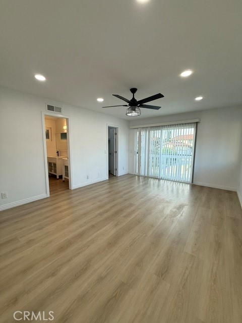 18104 Rio Seco Drive Rowland Heights, CA 91748 - Photo 23 of 31 an empty room with wooden floor and windows