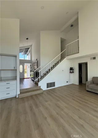 a view of a room with cabinet and windows