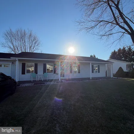 a view of house with yard