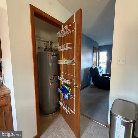 a view of a livingroom with a furniture and storage