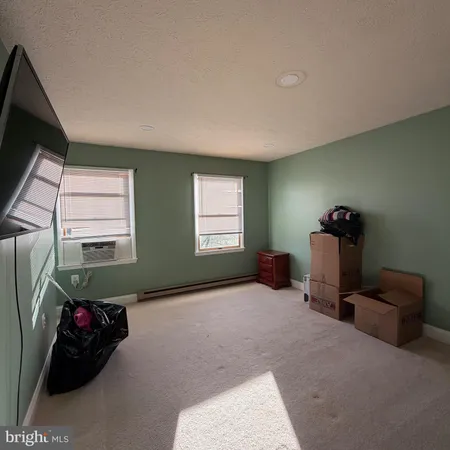 a bed room with furniture and a window