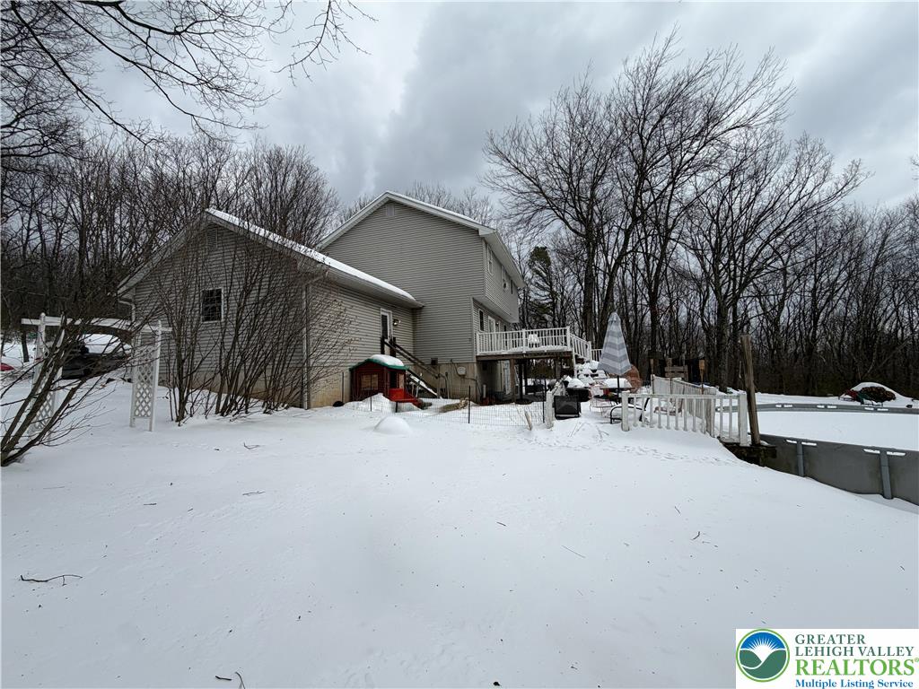 303 East Mountain Top Road Summit Hill, PA 18250 - Photo 7 of 31 a view of a house with a snow in the yard