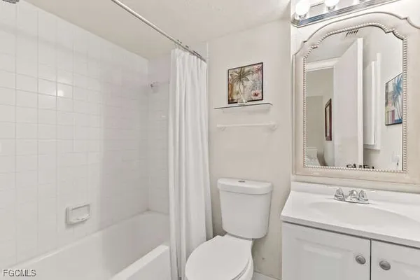 a bathroom with a sink a toilet and a bathtub