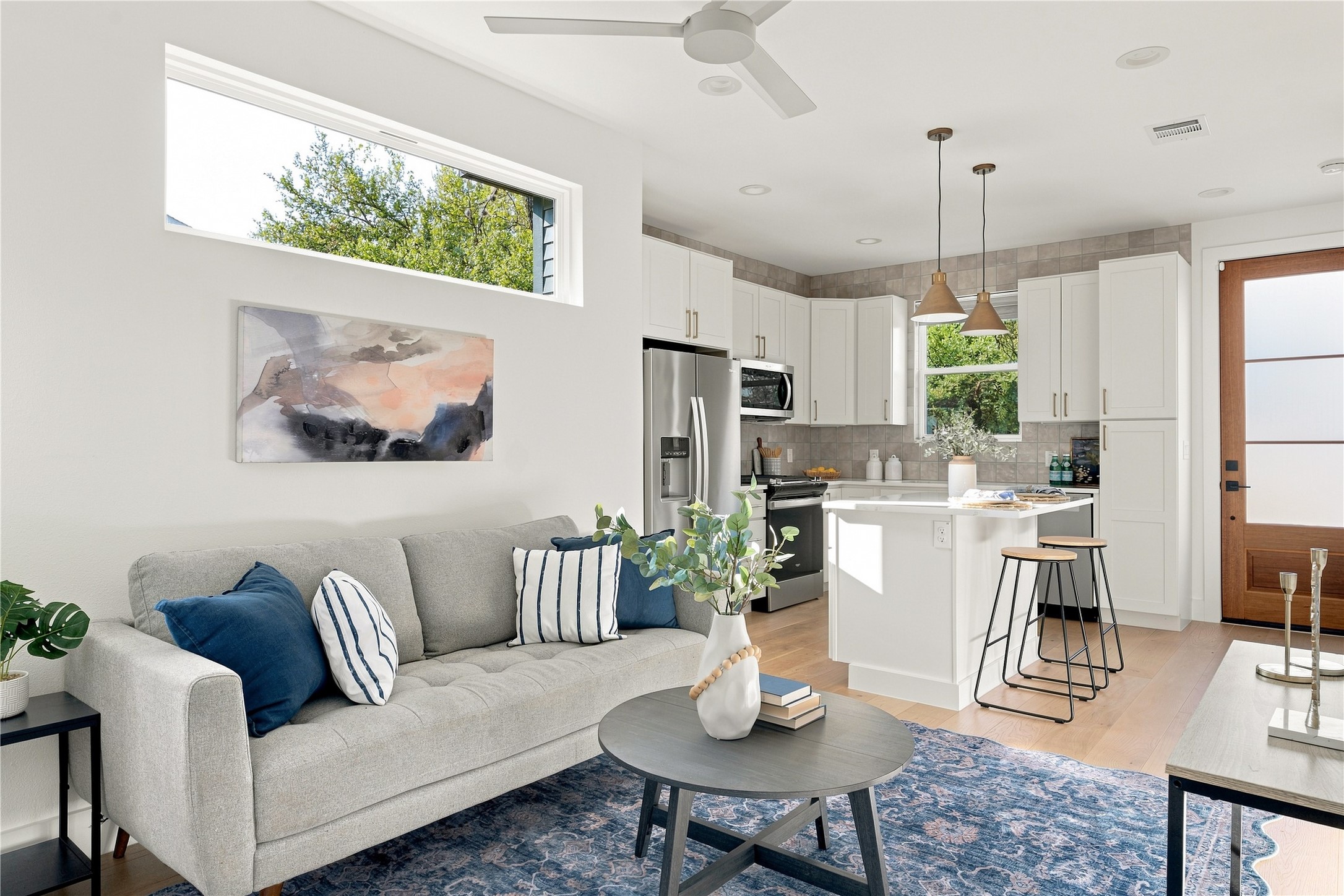 5506 Hudson Street, Unit 2 Austin, TX 78721 - Photo 5 of 24 High windows and natural light create a serene ambiance across this open-concept layout.