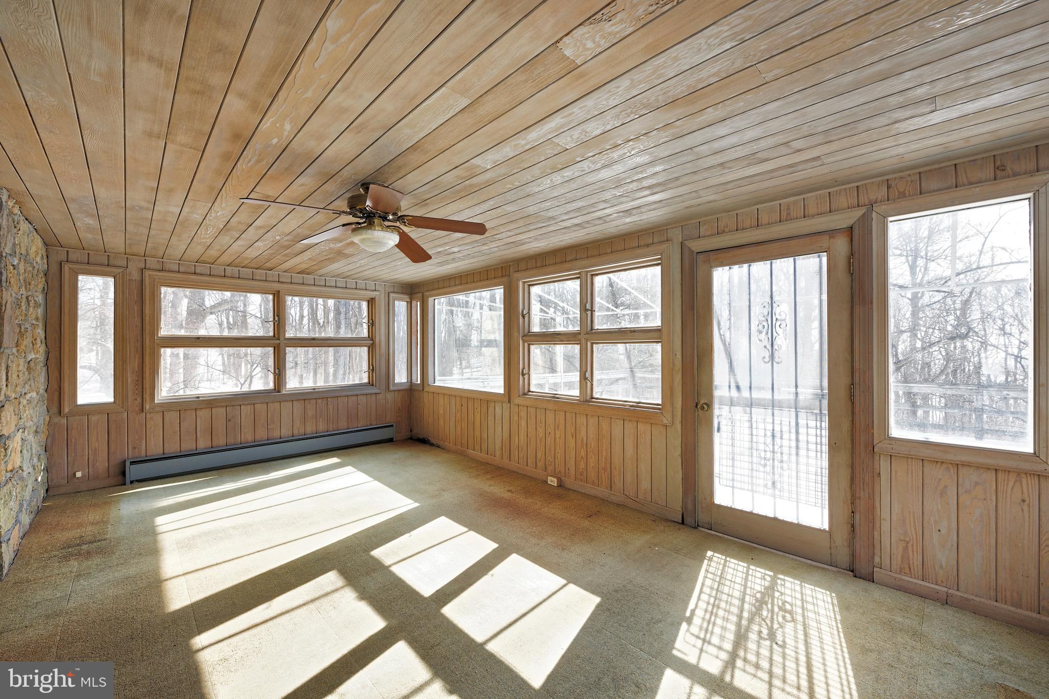 32843 Mt Weather Road Bluemont, VA 20135 - Photo 11 of 42 Sunroom is filled w/windows & opens on to the deck