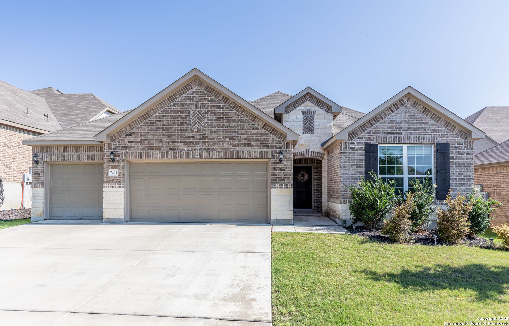 7421 Cimarron Lake Boerne, TX 78015 - Photo 1 of 1 a front view of a house with garden