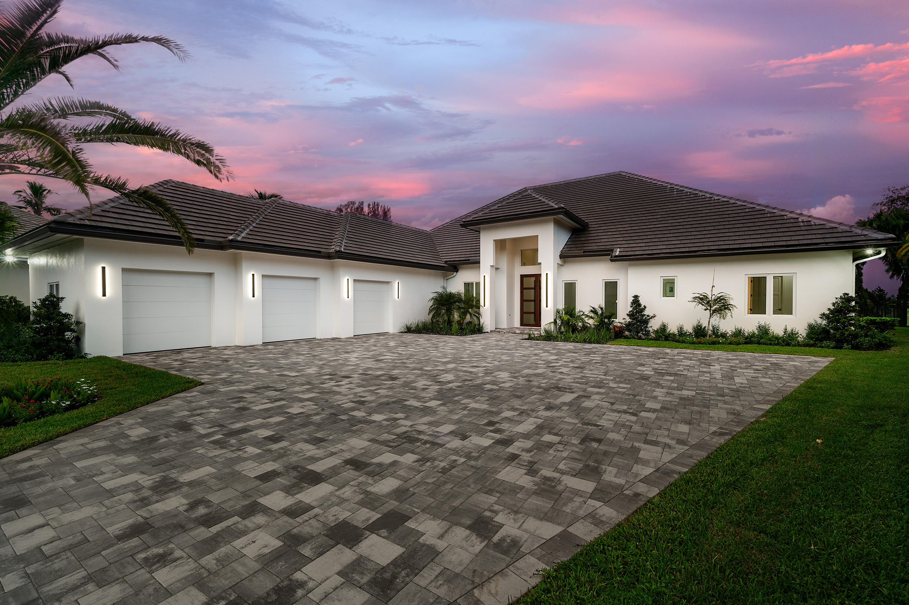 100 Glenbrook Court Atlantis, FL 33462 - Photo 3 of 96 Front Twilight