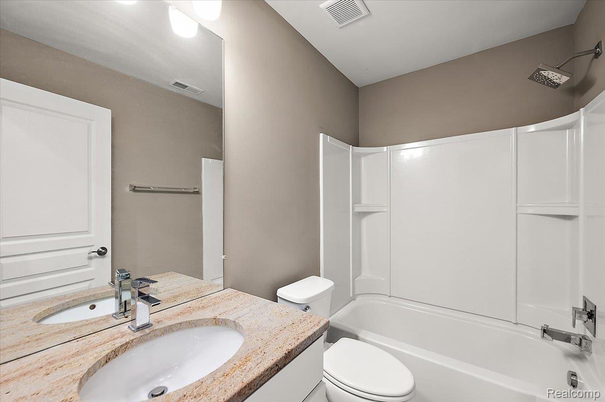 2877 Hartwick Drive Rochester, MI 48307 - Photo 40 of 44 Full bath featuring vanity and tub / shower combination