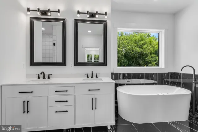 a bathroom with a bathtub and a sink