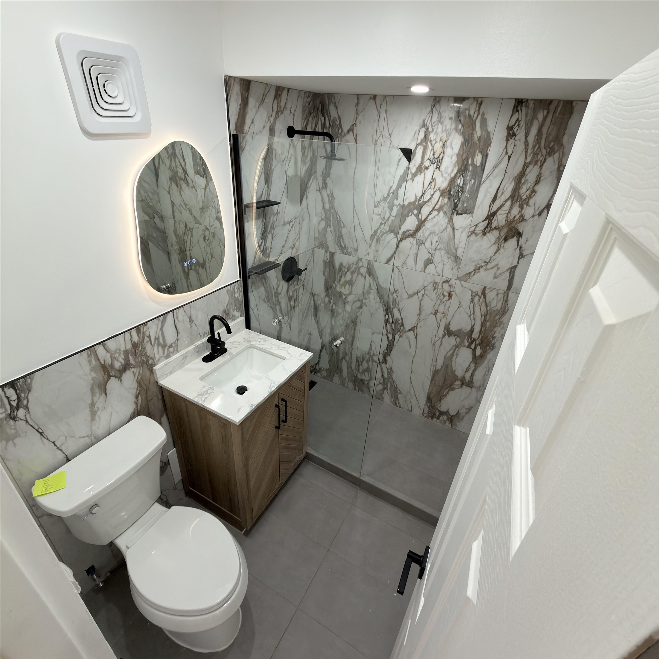 810 23rd Street, Unit 3 Union City, NJ 07087 - Photo 2 of 12 a white toilet sitting next to a bathroom sink