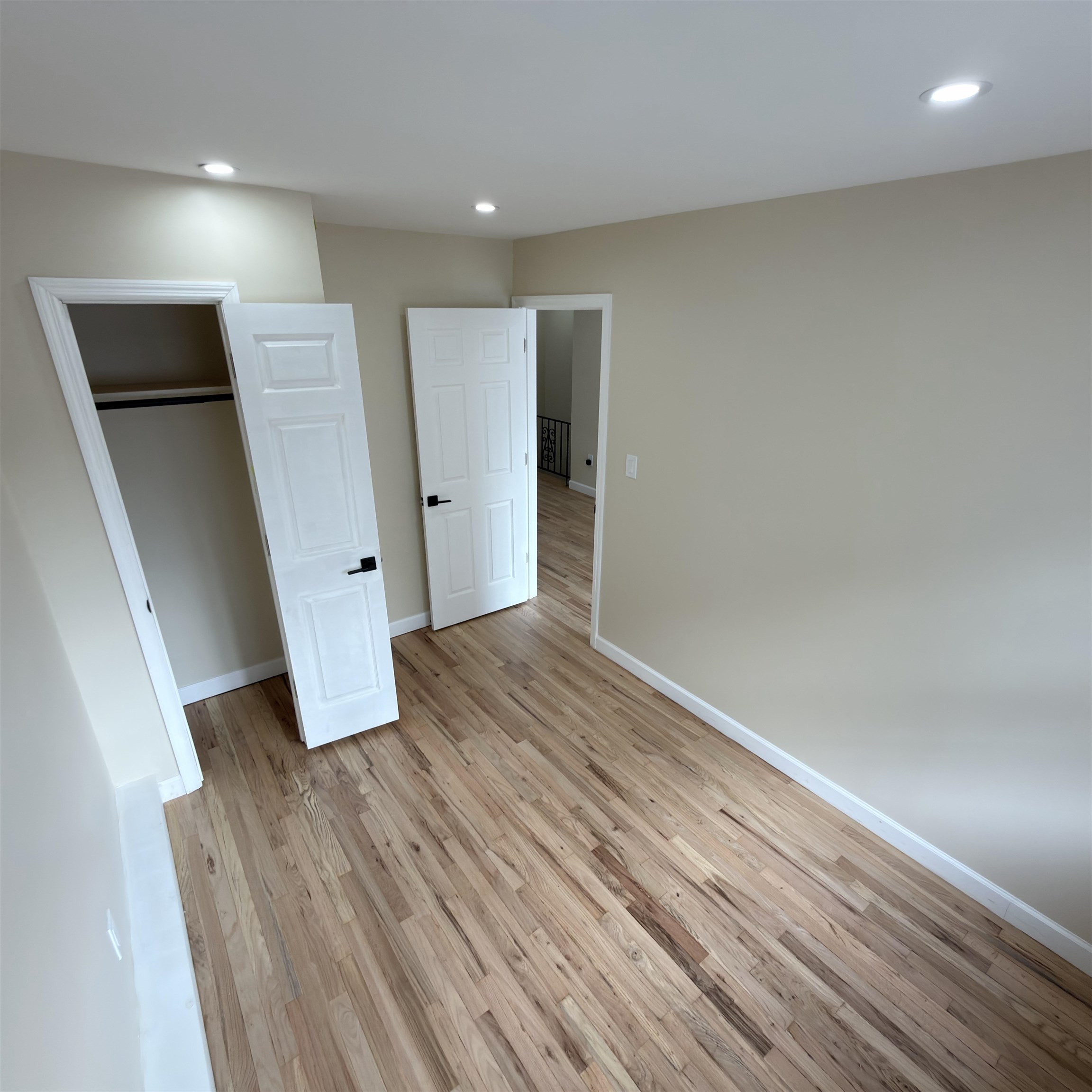 810 23rd Street, Unit 3 Union City, NJ 07087 - Photo 6 of 12 wooden floor in an empty room with a window