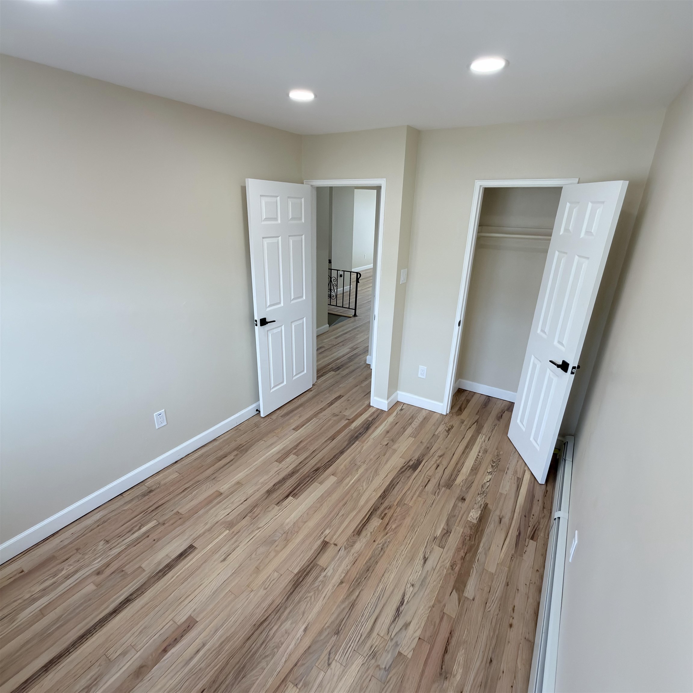 810 23rd Street, Unit 3 Union City, NJ 07087 - Photo 9 of 12 a view of a room with wooden floor and staircase