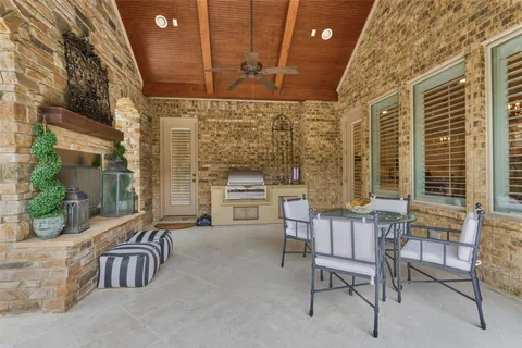a view of a house with backyard and porch