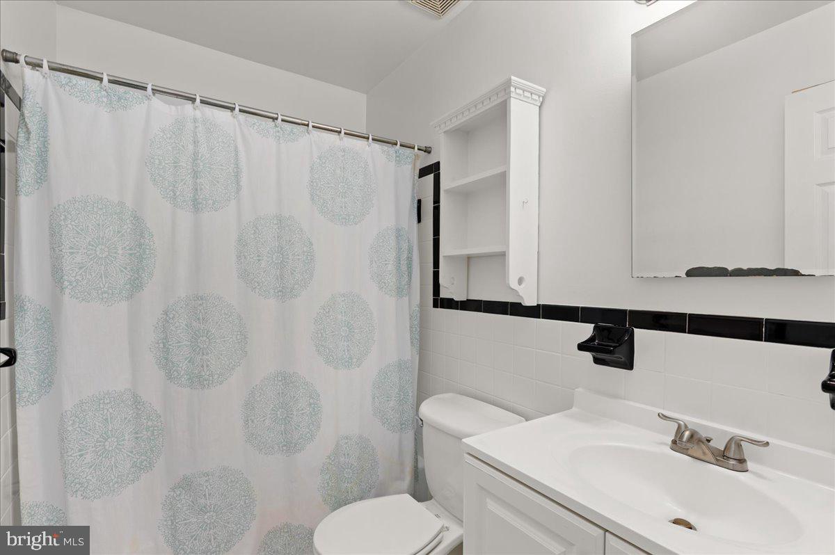 8606 Grubb Road Chevy Chase, MD 20815 - Photo 19 of 31 Main level hall full bathroom