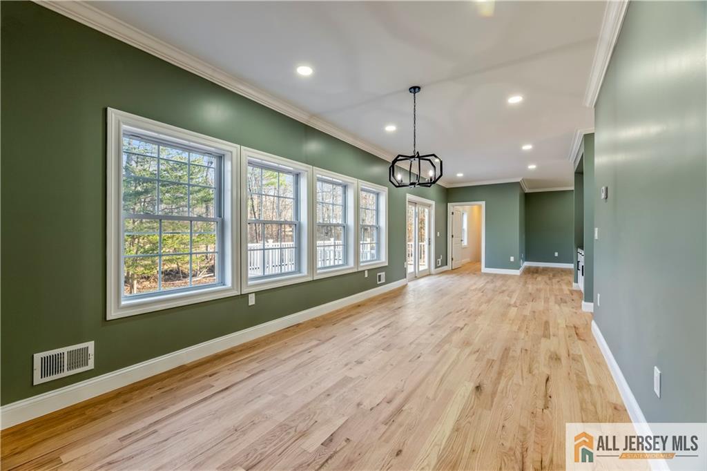 28 King George Road Warren, NJ 07059 - Photo 11 of 63 a view of hallway with a large window and chandelier