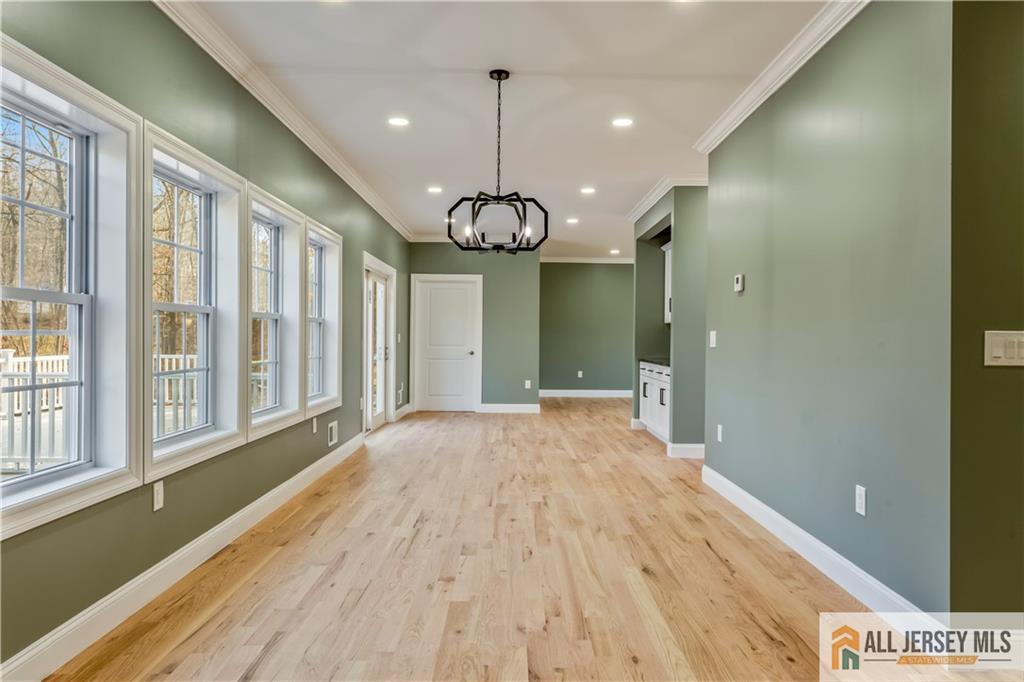 28 King George Road Warren, NJ 07059 - Photo 12 of 63 a view of a room with wooden floor and windows