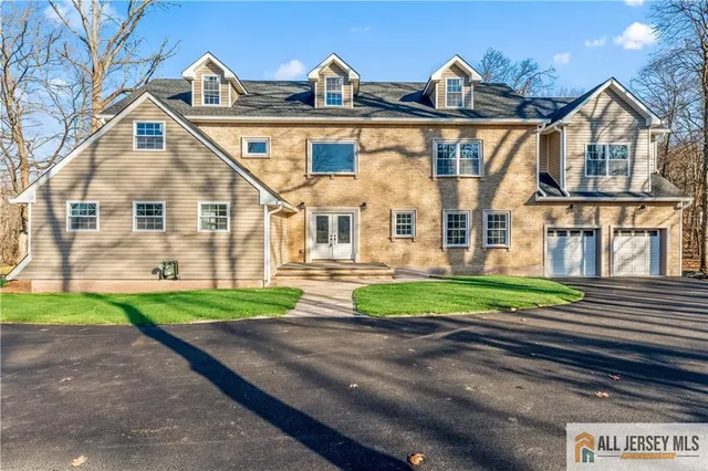 a view of house with a yard