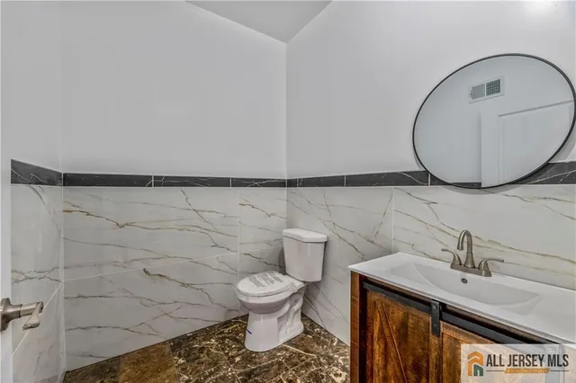 a bathroom with a toilet and a sink