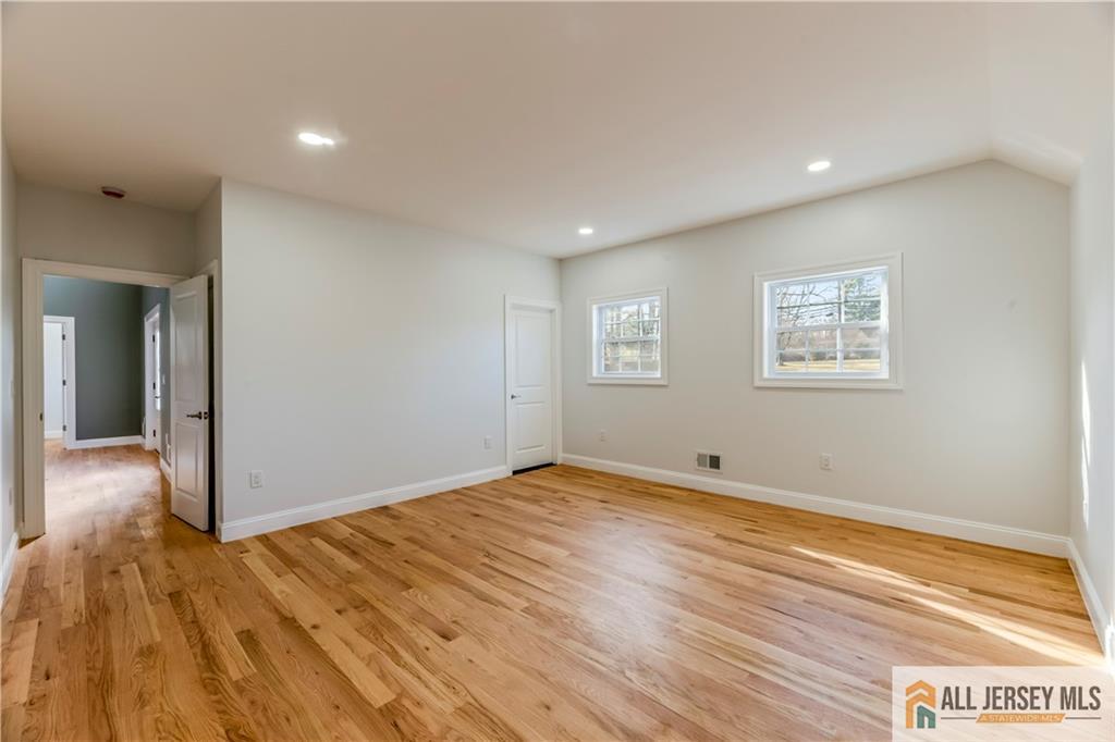 28 King George Road Warren, NJ 07059 - Photo 26 of 63 a view of empty room with wooden floor