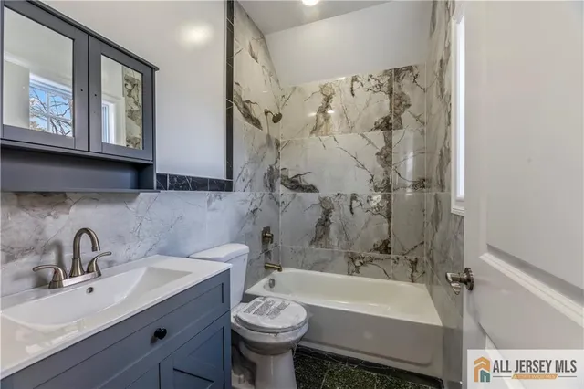 a bathroom with a sink and a bathtub