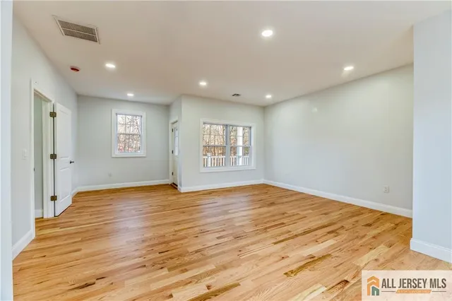 a view of a balcony with wooden floor
