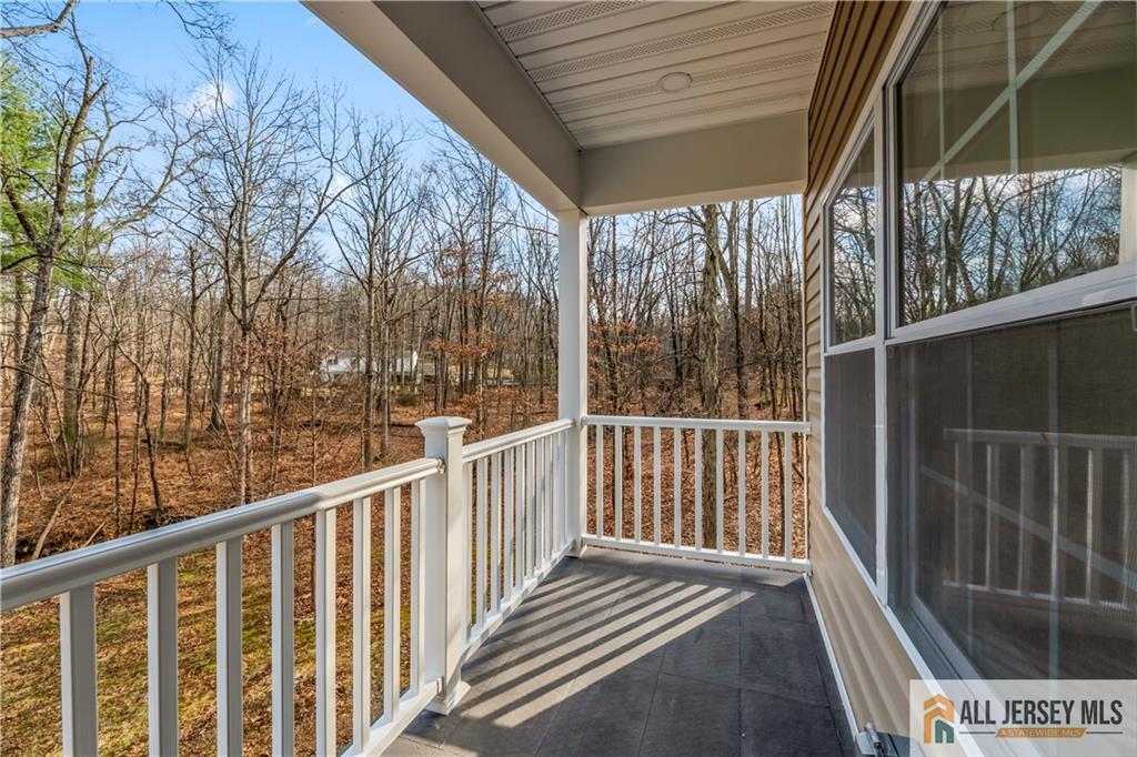 28 King George Road Warren, NJ 07059 - Photo 36 of 63 a view of a balcony with wooden floor